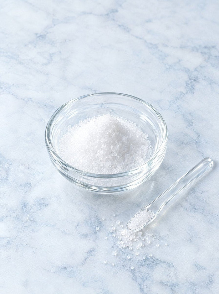 Niacinamide crystals in a glass dish